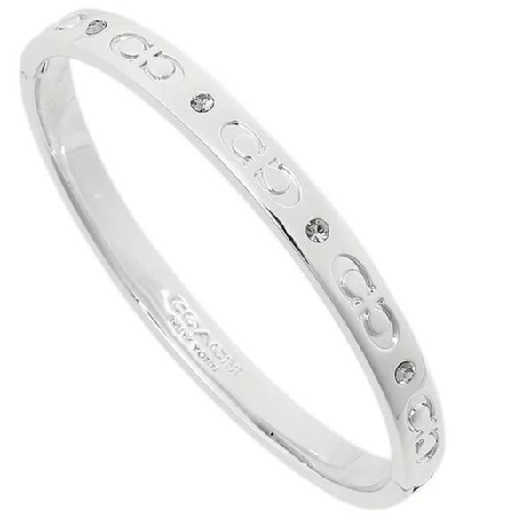 Coach Jewelry - COACH Kissing C Hinged Silver Bangle
